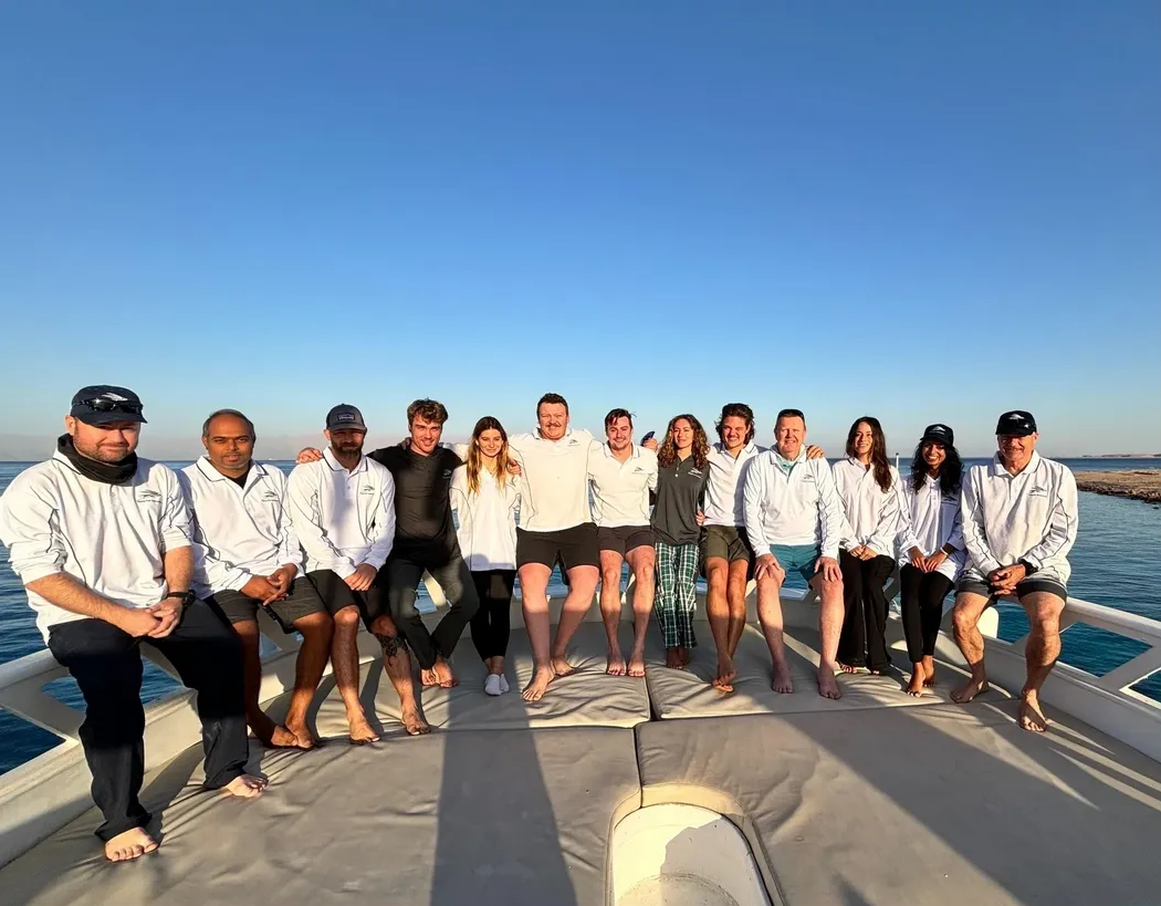Flying Fish Technologies team seated together on a vessel.